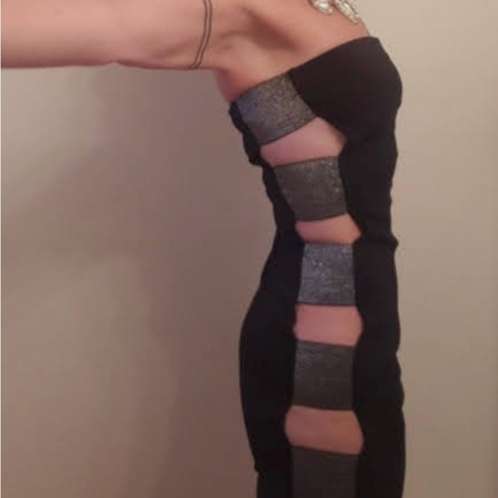 Elegant Black Dress with Cut out sides and  Silver Accents. Size s